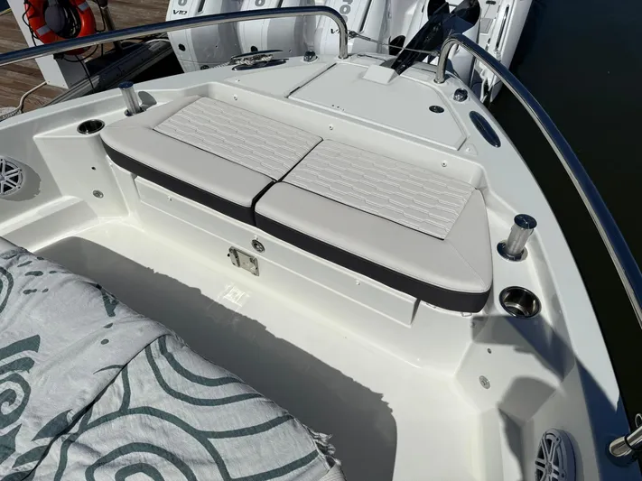  Yacht Photos Pics 2023 Wellcraft 38 Explorer boat interior with cushioned seating and sleek design.