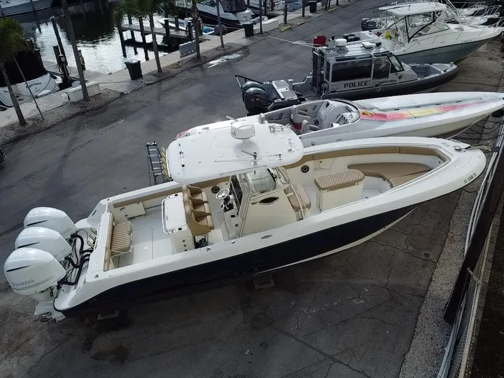  Yacht Photos Pics 2006 Hydra-Sports Vector 3300 CC boat docked with twin engines, aerial view.