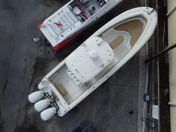  Yacht Photos Pics Aerial view of a 2006 Hydra-Sports Vector 3300 CC boat with triple outboard engines.