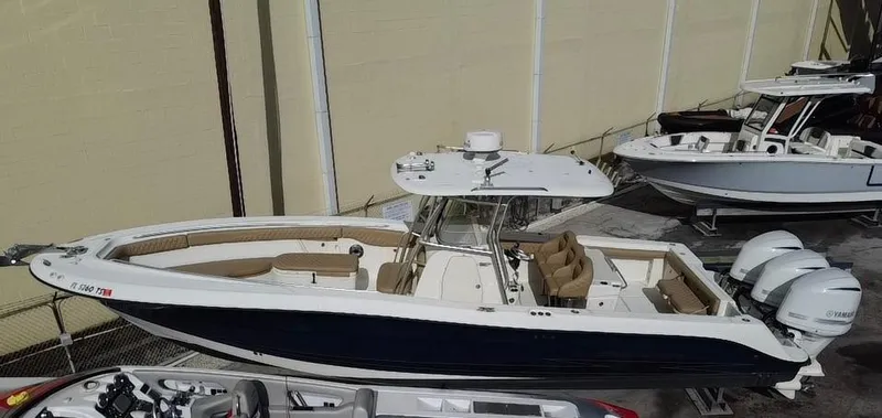  Yacht Photos Pics 2006 Hydra-Sports Vector 3300 CC boat with dual engines, docked in a marina.