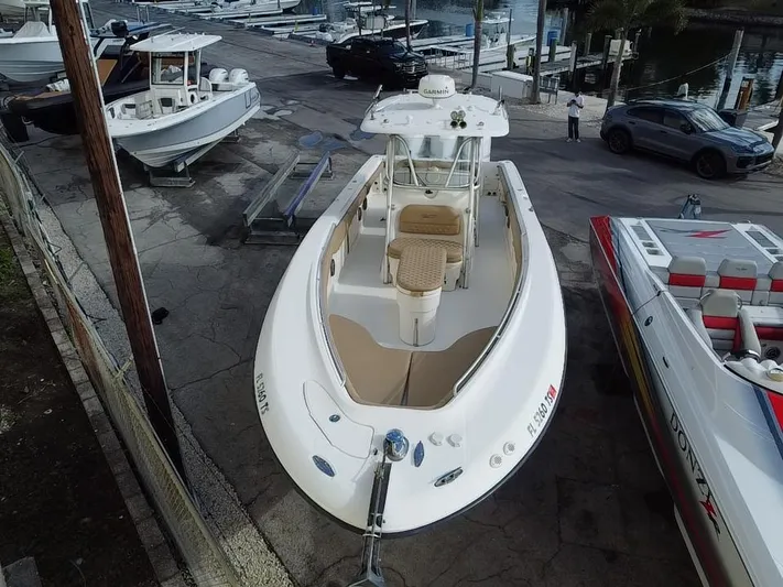  Yacht Photos Pics 2006 Hydra-Sports Vector 3300 CC boat docked at marina, aerial view.