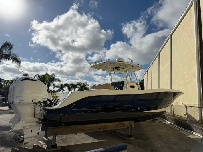  Yacht Photos Pics 2006 Hydra-Sports Vector 3300 CC boat with Yamaha engines, docked under a cloudy sky.