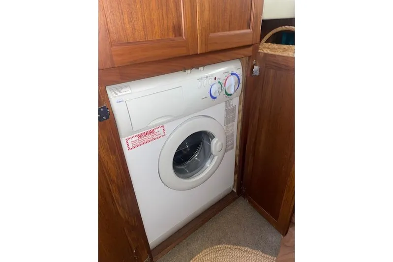  Yacht Photos Pics Washing machine inside a 2006 Nordic Tug 42 wooden cabinet.