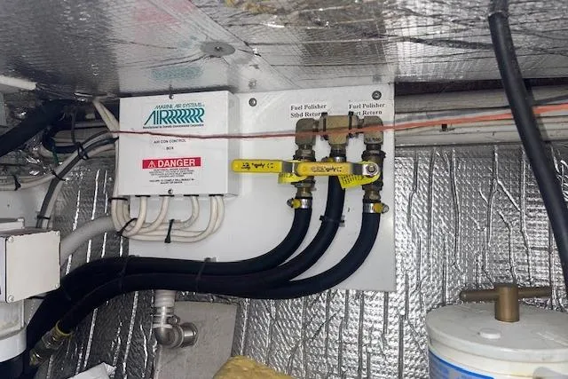  Yacht Photos Pics Engine room of 2006 Nordic Tug 42 with fuel polisher system and insulated walls.