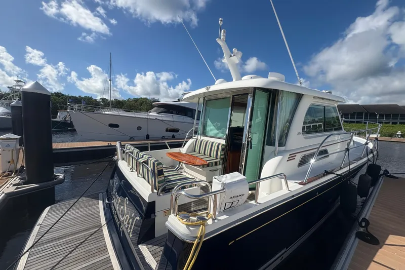  Yacht Photos Pics 2016 Sabre 38 Salon Express yacht docked under a bright blue sky.