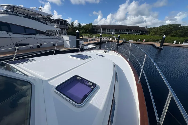  Yacht Photos Pics 2016 Sabre 38 Salon Express yacht docked at marina under blue sky.