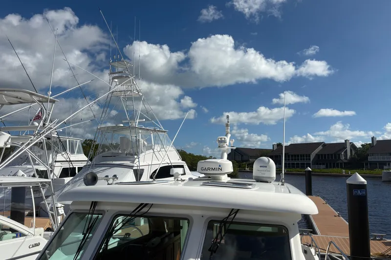  Yacht Photos Pics 2016 Sabre 38 Salon Express docked at marina under blue sky.