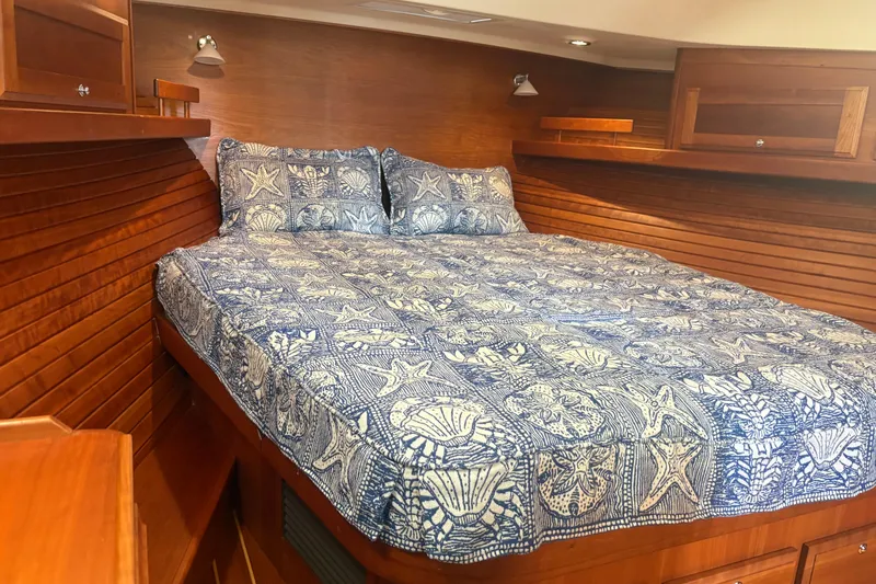  Yacht Photos Pics Cozy cabin bedroom in 2016 Sabre 38 Salon Express with nautical-themed bedding.