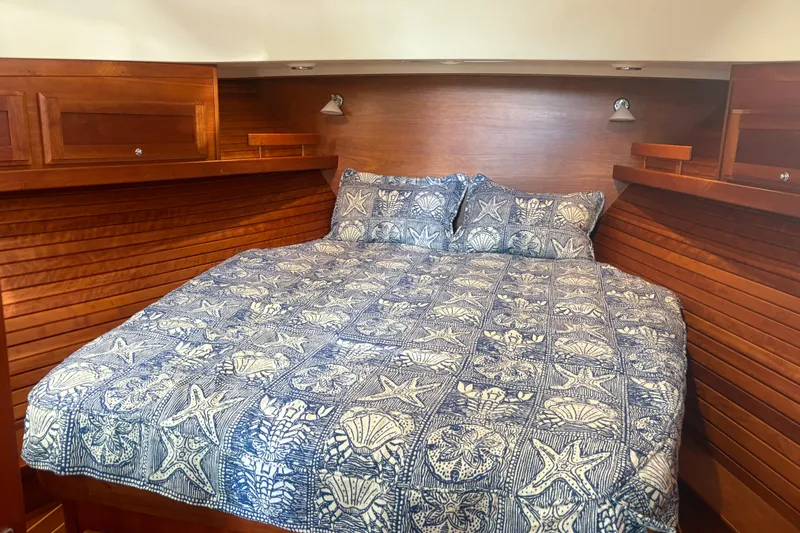  Yacht Photos Pics Cozy cabin bedroom in 2016 Sabre 38 Salon Express with nautical-themed bedding.