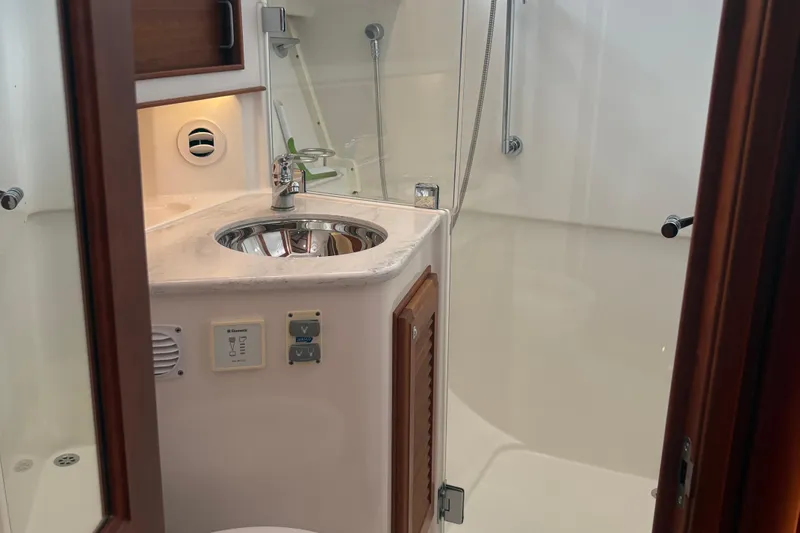  Yacht Photos Pics 2016 Sabre 38 Salon Express bathroom with modern fixtures and sleek design.