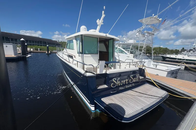 Yacht Photos Pics 2016 Sabre 38 Salon Express yacht docked at marina under clear blue sky.