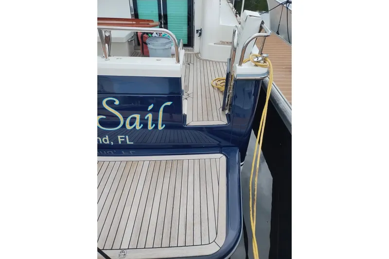  Yacht Photos Pics 2016 Sabre 38 Salon Express yacht with teak deck and docked at marina.