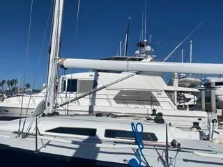 Blue Blazes Yacht Photos Pics Reichel/Pugh 50 sailboat, 1992 model, docked at a marina under clear blue sky.