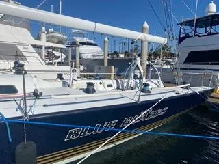 Blue Blazes Yacht Photos Pics Reichel/Pugh 50 sailboat, 1992 model, named Blue Blazes docked at a marina.