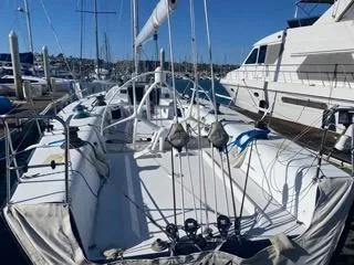 Blue Blazes Yacht Photos Pics 1992 Reichel/Pugh 50 sailboat docked at marina, surrounded by other boats.