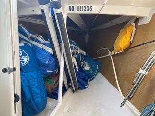 Blue Blazes Yacht Photos Pics Storage area of a 1992 Reichel/Pugh 50 sailboat with sails and equipment.