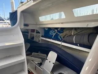 Blue Blazes Yacht Photos Pics Interior of a 1992 Reichel/Pugh 50 sailboat with storage and seating areas.