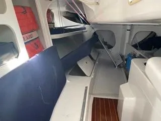 Blue Blazes Yacht Photos Pics Interior of 1992 Reichel/Pugh 50 sailboat with blue cushions and life jackets.