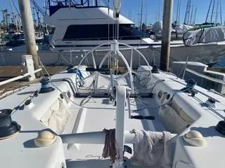 Blue Blazes Yacht Photos Pics Reichel/Pugh 50 sailboat, 1992 model, docked at marina with other boats in background.