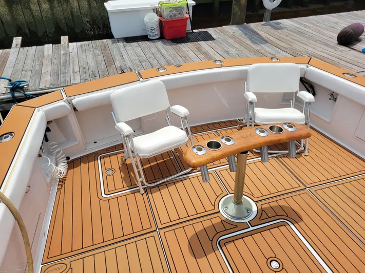 The Dog Patch Yacht Photos Pics Deck of 1990 Ocean Yachts 48 Super Sport with chairs and rod holders.