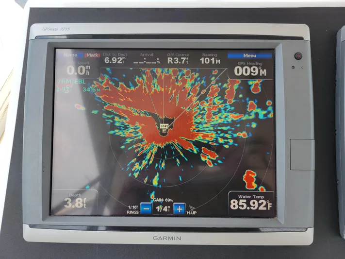 The Dog Patch Yacht Photos Pics Garmin GPS display on 1990 Ocean Yachts 48 Super Sport, showing navigation and water temperature.