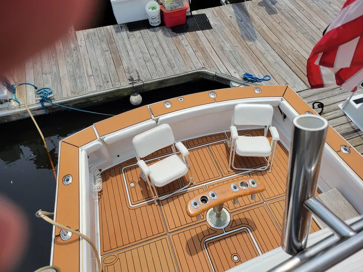 The Dog Patch Yacht Photos Pics 1990 Ocean Yachts 48 Super Sport boat docked with chairs and fishing rod holders.