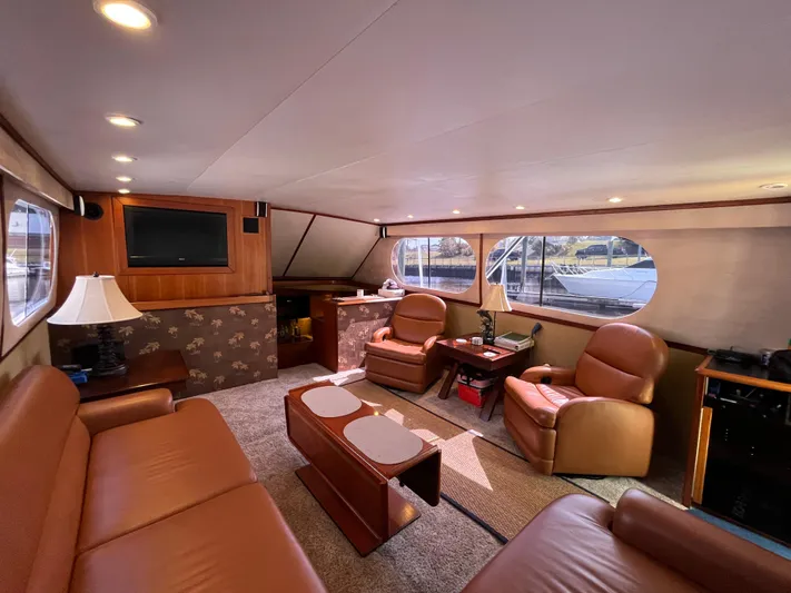 The Dog Patch Yacht Photos Pics Luxurious interior of 1990 Ocean Yachts 48 Super Sport with leather seating and large windows.