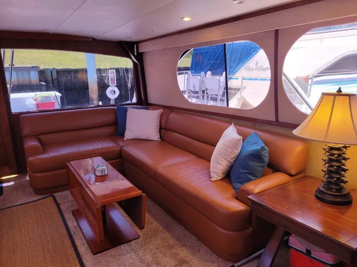 The Dog Patch Yacht Photos Pics Luxurious interior of a 1990 Ocean Yachts 48 Super Sport with leather seating and elegant decor.