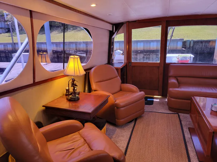 The Dog Patch Yacht Photos Pics Luxurious interior of 1990 Ocean Yachts 48 Super Sport with leather seating and elegant decor.