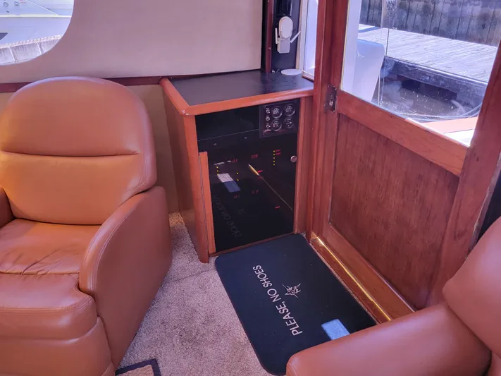 The Dog Patch Yacht Photos Pics Interior of 1990 Ocean Yachts 48 Super Sport with leather seating and control panel.