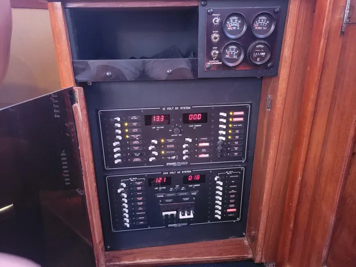 The Dog Patch Yacht Photos Pics Electrical panel of a 1990 Ocean Yachts 48 Super Sport, featuring gauges and switches.