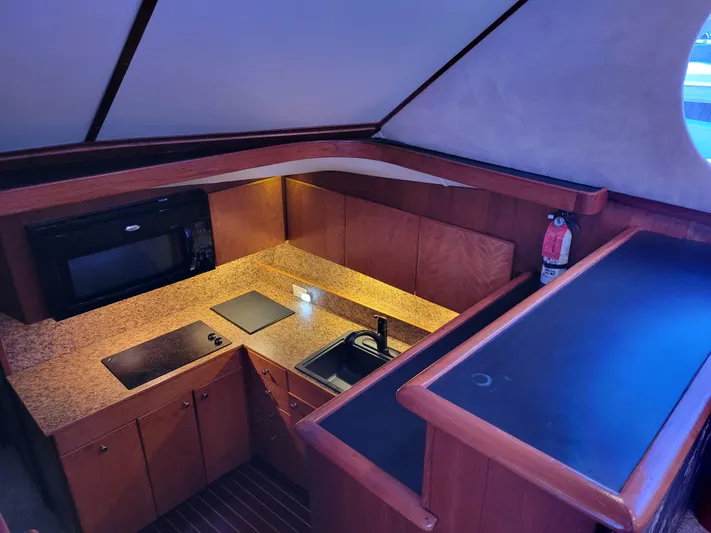 The Dog Patch Yacht Photos Pics Interior of 1990 Ocean Yachts 48 Super Sport kitchen with modern amenities.