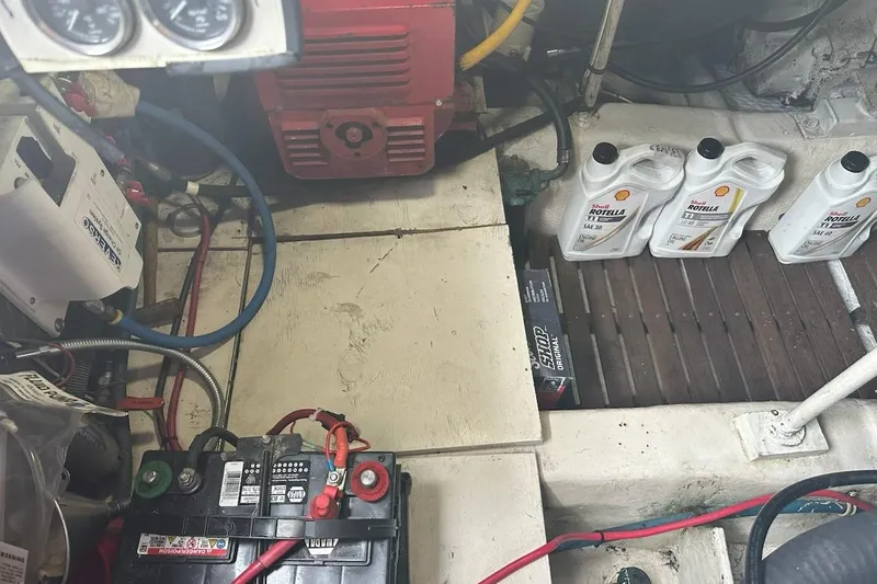 The Dog Patch Yacht Photos Pics Engine room of 1990 Ocean Yachts 48 Super Sport with batteries and oil containers.