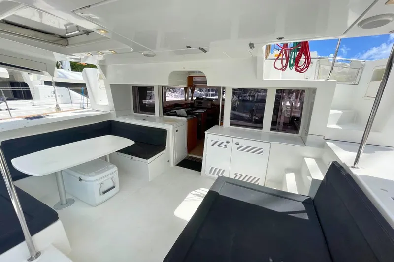Take It Easy Yacht Photos Pics Spacious 2018 Lagoon 450 F yacht interior with seating, table, and kitchen area.
