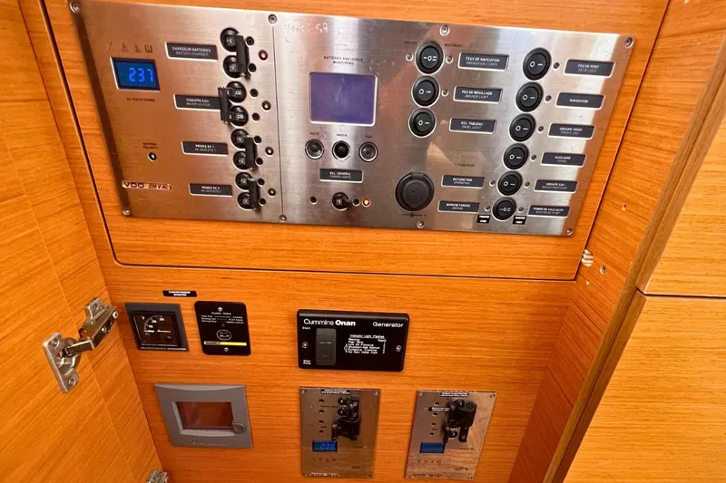 Take It Easy Yacht Photos Pics Electrical control panel of a 2018 Lagoon 450 F yacht, featuring various switches and displays.