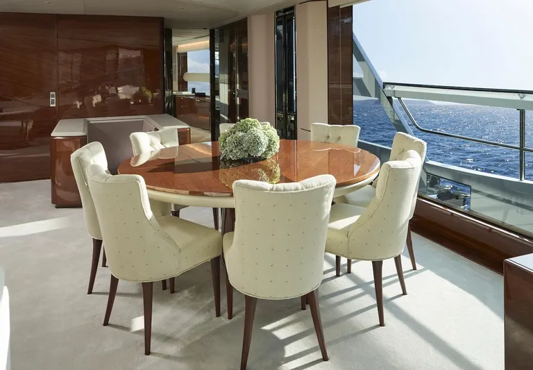  Yacht Photos Pics Luxurious dining area on 2025 Princess X95 yacht with ocean view.
