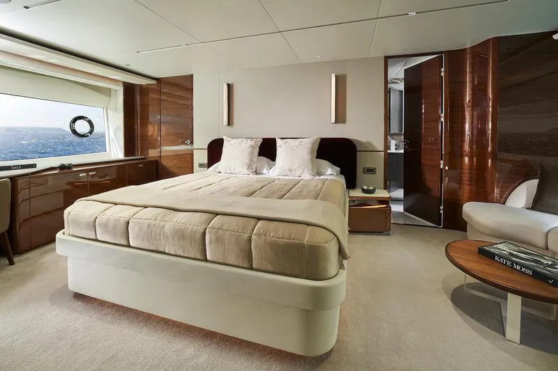  Yacht Photos Pics Luxurious bedroom interior of 2025 Princess X95 yacht with modern design and ocean view.