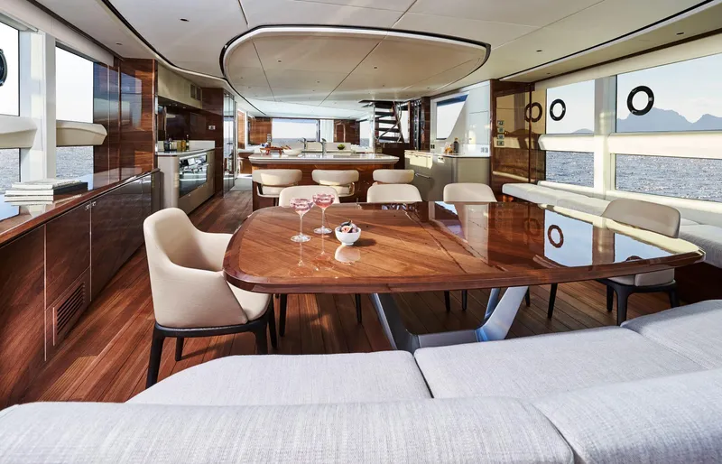 Yacht Photos Pics Luxurious interior of 2025 Princess X95 yacht with elegant dining area and ocean view.