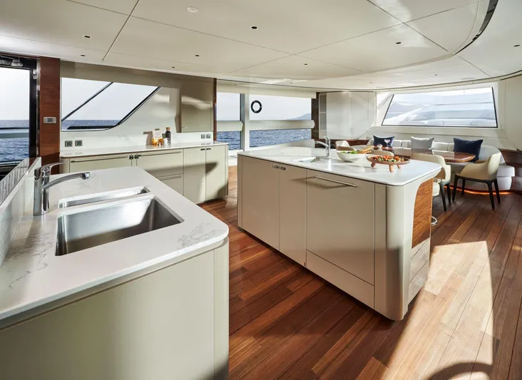  Yacht Photos Pics Luxurious 2025 Princess X95 yacht interior with modern kitchen and ocean view.