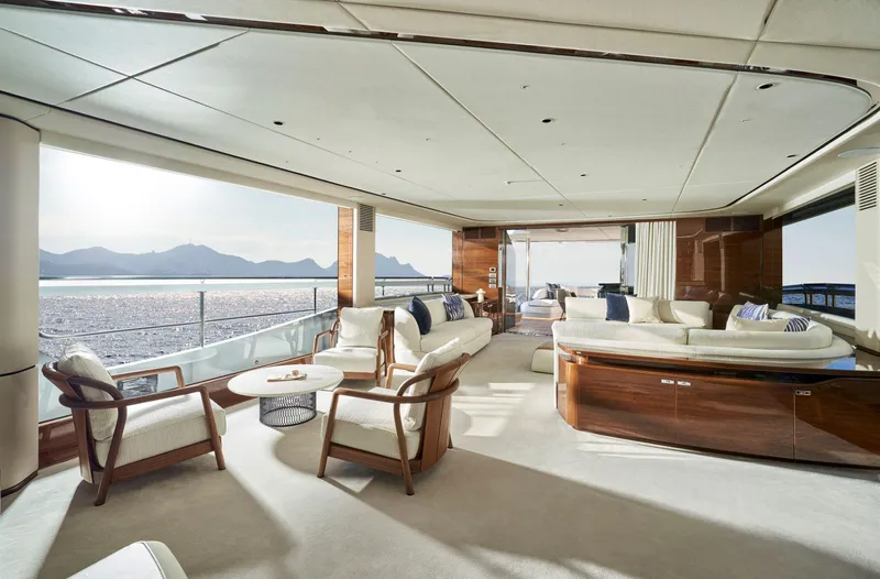  Yacht Photos Pics Luxurious interior of 2025 Princess X95 yacht with elegant seating and ocean view.