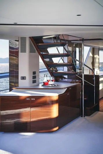  Yacht Photos Pics Luxurious interior of 2025 Princess X95 yacht with modern staircase and elegant design.