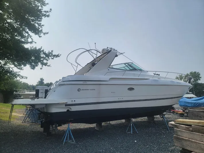  Yacht Photos Pics 2000 Cruisers 3870 Express yacht on stands, side view, outdoors.