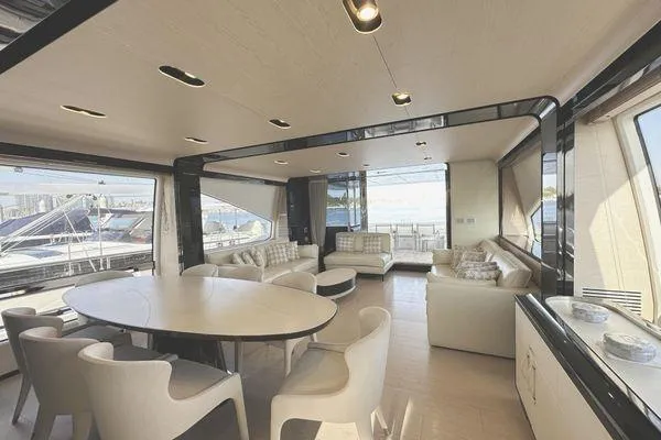  Yacht Photos Pics Luxurious interior of 2015 Azimut 80 yacht with modern seating and dining area.