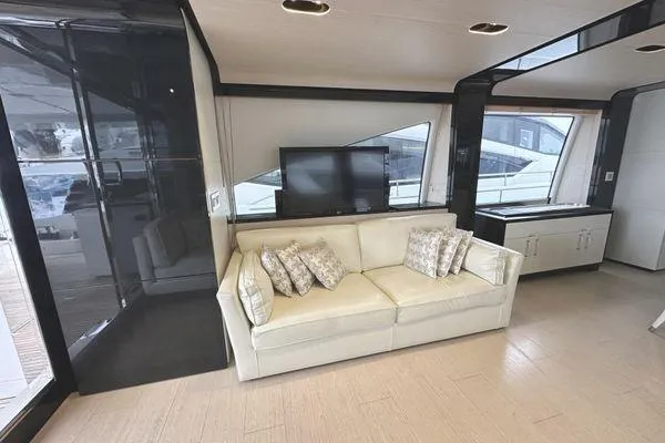  Yacht Photos Pics Luxurious interior of 2015 Azimut 80 yacht with sofa and TV.