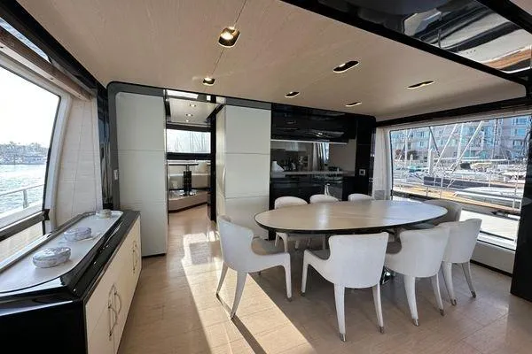  Yacht Photos Pics Luxurious dining area on a 2015 Azimut 80 yacht, featuring elegant seating and modern design.