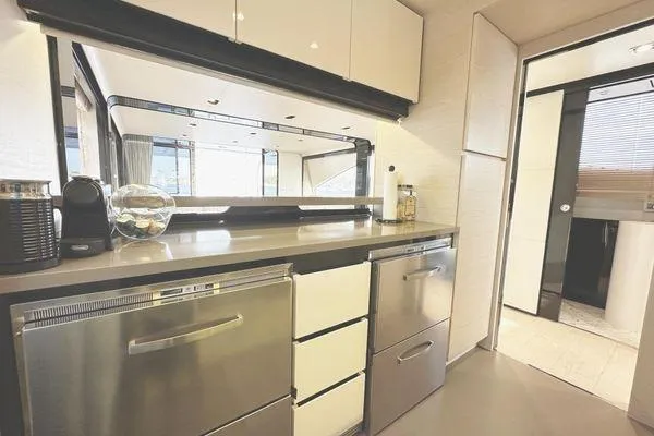  Yacht Photos Pics Luxurious kitchen interior of 2015 Azimut 80 yacht with modern appliances and sleek design.