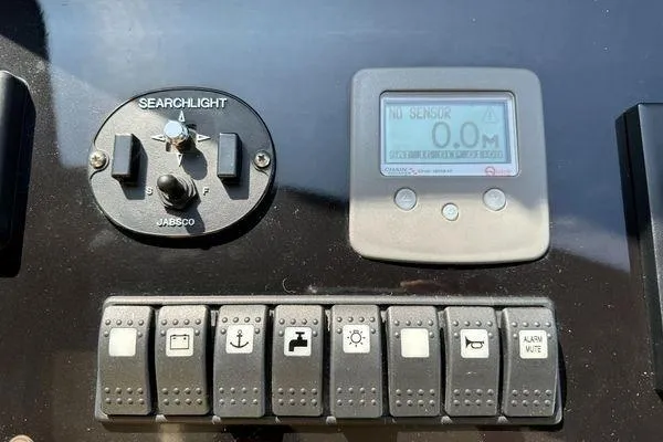  Yacht Photos Pics Control panel of a 2015 Azimut 80 yacht with switches and display.