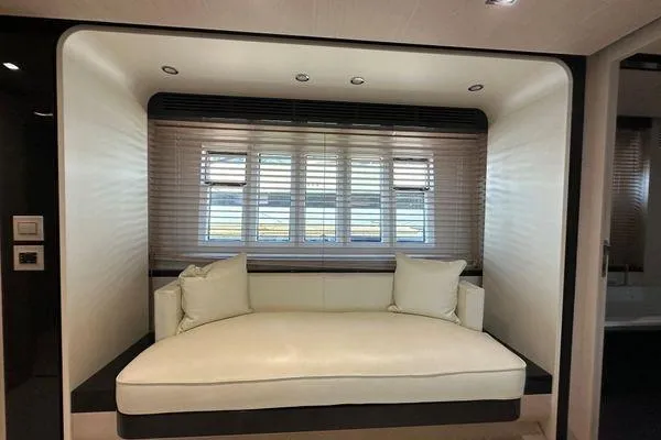  Yacht Photos Pics Luxurious interior of 2015 Azimut 80 yacht with elegant white seating and window blinds.