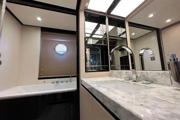  Yacht Photos Pics Luxurious bathroom in 2015 Azimut 80 yacht with marble countertop and modern fixtures.