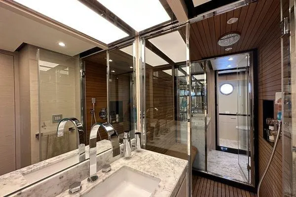  Yacht Photos Pics Luxurious bathroom in 2015 Azimut 80 yacht with marble sink and glass shower.